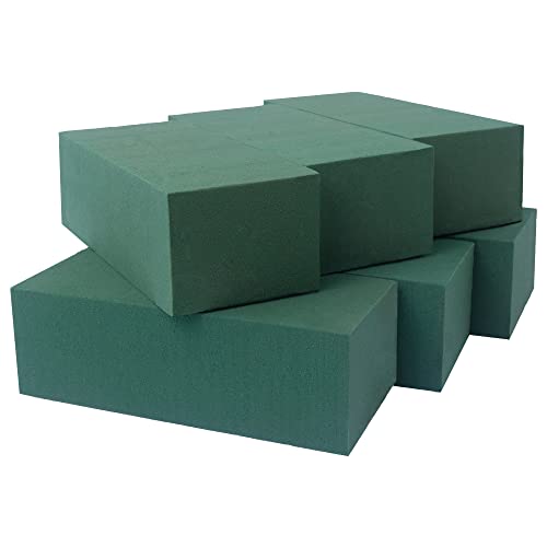 A stack of green rectangular floral foam blocks used in floristry for arranging fresh or artificial flowers, often serving as a water source for fresh blooms.