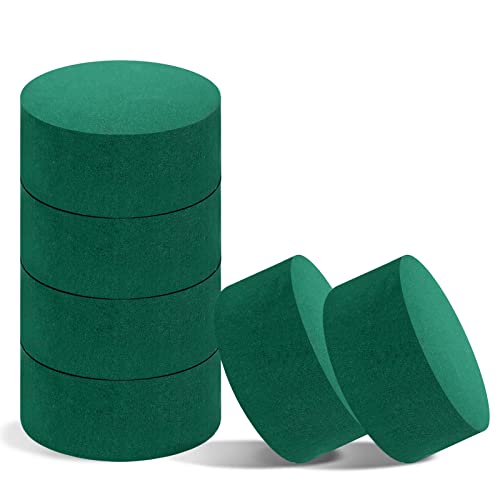 Six round, green floral foam blocks, stacked and displayed, for use in fresh or artificial flower arrangements